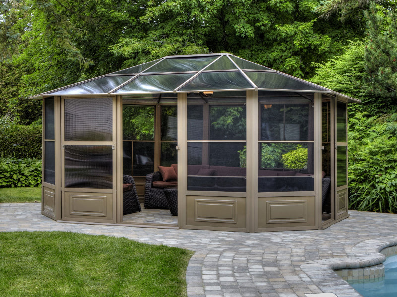 Hexagonal sunroom with glass walls in a garden setting
