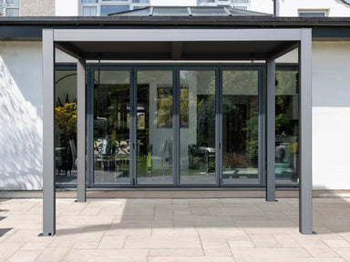 Gazebo Penguin Vikos Pergola on patio in front of glass door