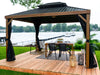 Wooden gazebo with outdoor furniture by a waterfront