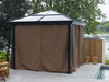Gazebo with brown curtains on a wooden deck by a body of water