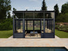 Modern garden room with glass walls in a backyard setting.