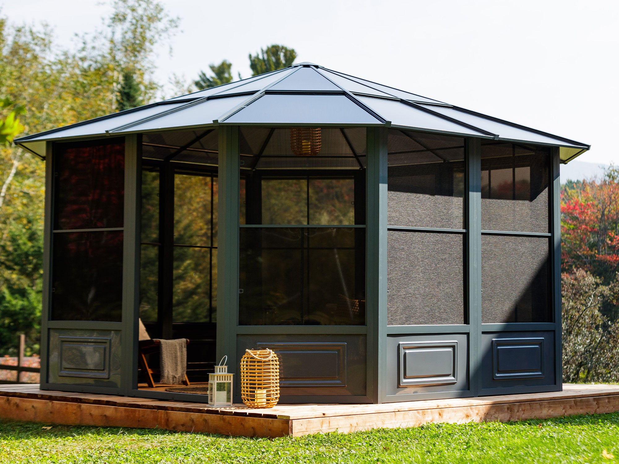 The penguin Florence Solarium 12x12 with the polycarbonate roof in the yard on a patio