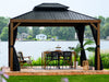 The Penguin Yosemite Gazebo on the patio overlooking the lake with a black roof and a wood finish