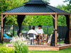 The penguin Yosemite gazebo on a patio with a family enjoying time together the view is from the lake