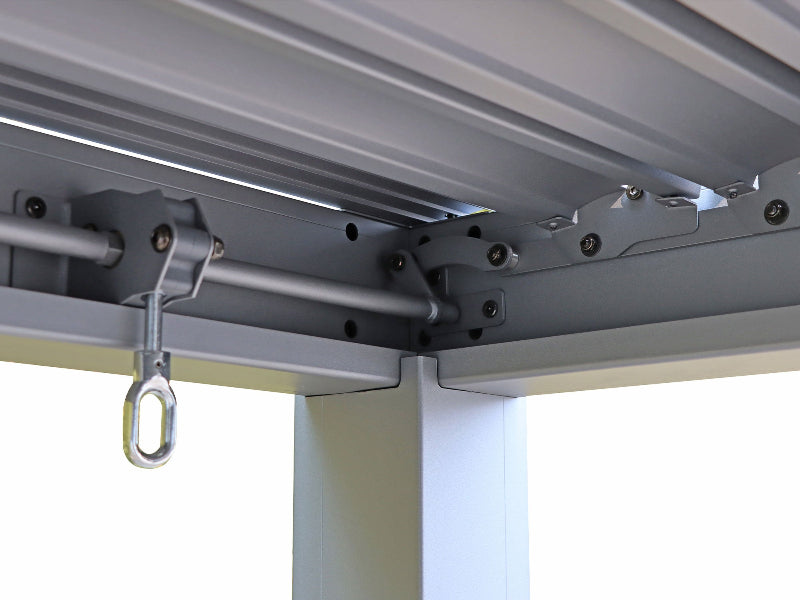 Metal bracket with a hook attached to a ceiling
